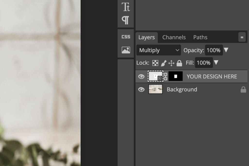 Screenshot of a photo editing software showing the Layers panel. The top layer is labeled YOUR DESIGN HERE, set to Multiply blending mode, with 100% opacity and a layer mask applied.